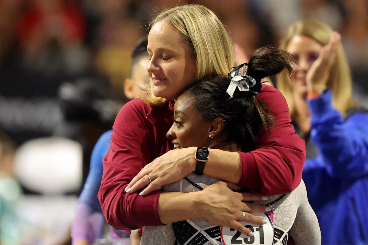 Cecile Landi, shown here with Simone Biles at last year's Core Hydration Classic, is one of the new head coaches of Georgia's women's gymnastics team.