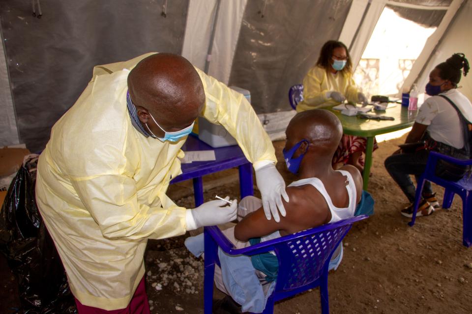 A medical worker administers a dose of COVID-19 vaccine for a man in Goma, northeast Democratic Republic of the Congo DRC, on Oct. 8, 2021. (Photo by Zanem/Xinhua via Getty Images)