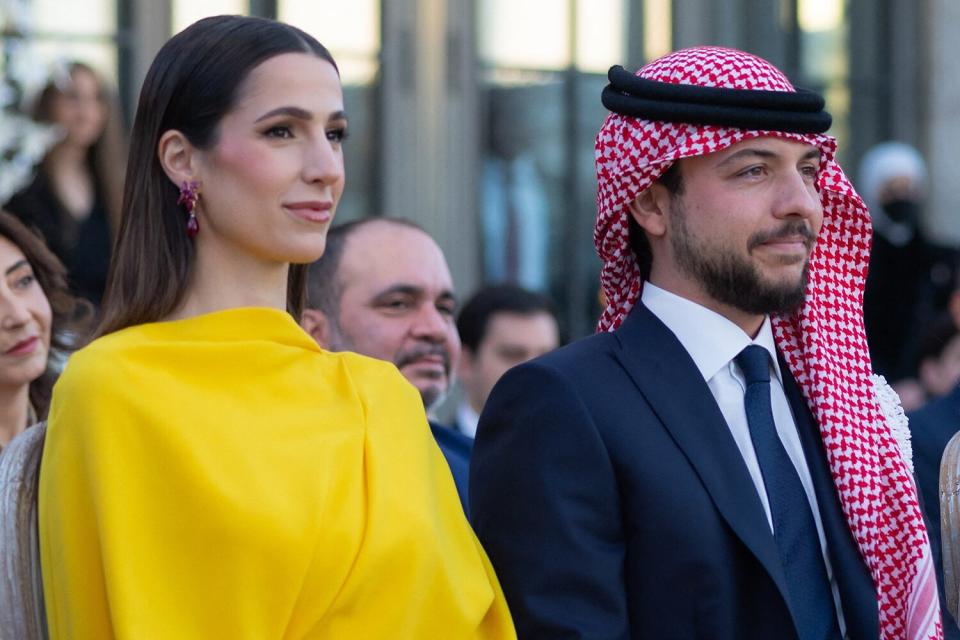 Jordan's Crown Prince Hussein (or Al Hussain) bin Abdullah II, between his mother Queen Rania (right) and his fiancee Rajwa Al Saif, at his sister Princess' Iman bint Abdullah II wedding, at Beit Al Urdun (House of Jordan) Palace in Amman, Jordan on March 12, 2023.