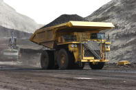 FILE - In this April 4, 2013, file photo, a mining dumper truck hauls coal at Cloud Peak Energy's Spring Creek strip mine near Decker, Mont. The Trump administration is considering using West Coast military bases or other federal properties as transit points for shipments of U.S. coal and natural gas to Asia. (AP Photo/Matthew Brown, File)