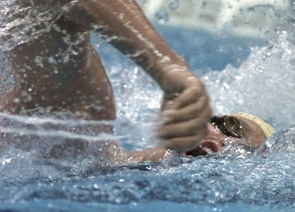 FILE - Kieren Perkins of Australia competes in the men's 1500 meter freestyle final at the 1996 Summer Olympic Games in Atlanta, Friday, July 26, 1996. Perkins won the gold medal. Two-time Olympic swimming gold medalist and Australian Sports Commission chief Perkins says “someone will die” if a multi-sport event that he called “borderline criminal” and which allows banned substances goes ahead. (AP Photo/David Longstreath, File)