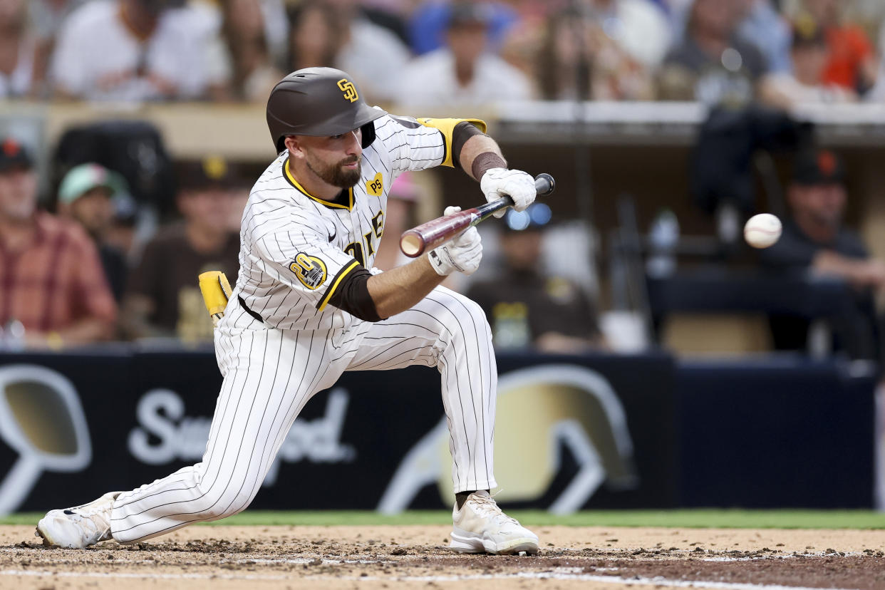 San Diego Padres' Mason McCoy, who was out at first, sacrifice bunts during the fifth inning of a baseball game against the San Francisco Giants, Saturday, Sept. 7, 2024, in San Diego. (AP Photo/Ryan Sun)