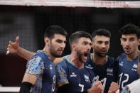 Argentina's Facundo Conte, #7, huddles with teammates during a men's volleyball preliminary round pool B match against the United States, at the 2020 Summer Olympics, early Monday, Aug. 2, 2021, in Tokyo, Japan. (AP Photo/Manu Fernandez)