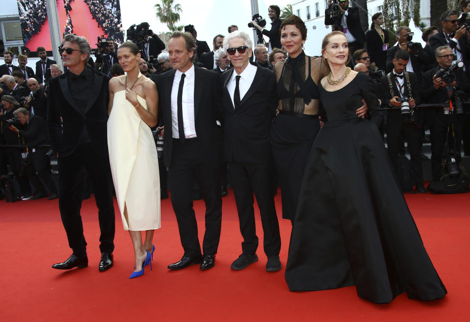 Pawel Pawlikowski, left, Malgorzata Bela, Peter Sarsgaard, David Cronenberg, Maggie Gyllenhaal, and Isabelle Huppert pose for photographers upon arrival at the 75th anniversary celebration of the Cannes film festival and the premiere of the film 'The Innocent' at the 75th international film festival, Cannes, southern France, Tuesday, May 24, 2022. (Photo by Joel C Ryan/Invision/AP)