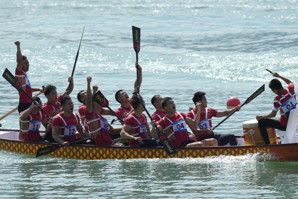 China's dragon boat team celebrate after they win the Men's Dragon Boat 200m Grand Final during the 19th Asian Games at the Wenzhou Dragon Boat Center in Wenzhou, China, Wednesday, Oct. 4, 2023. (AP Photo/Eugene Hoshiko)