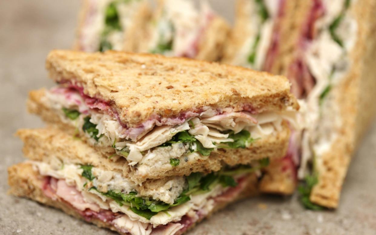 Most people eat sandwiches at their desk during their lunch hour - www.Alamy.com