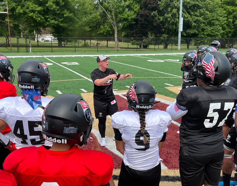 U.S. Women’s Tackle National Team head coach Callie Brownson speaks to players during training camp Saturday at Walsh University in North Canton. The Americans will be seeking their fourth consecutive gold medal in the International Federation of American Football Women’s Tackle World Championship this summer in Finland.