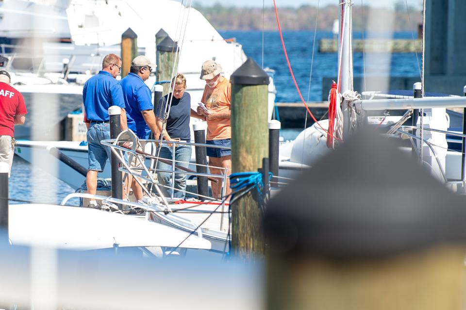 Ft Myers Police and Firefighters informing the residents and boat owners that they must leave the Ft Myers Yacht Basin, while residents are strongly opposed to leaving their boats. Friday, Oct. 7, 2022.