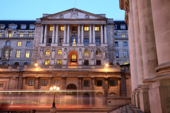 Bank of England, Threadneedle St, London.  Long exposure showing London bus passing in foreground