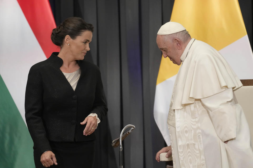 Hungarian President Katalin Novak, left, and Pope Francis arrive for a meeting with the authorities, civil society, and the diplomatic corps in the former Carmelite Monastery in Budapest, Hungary, Friday, April 28, 2023. The Pontiff is in Hungary for a three-day pastoral visit. (AP Photo/Andrew Medichini, Pool)