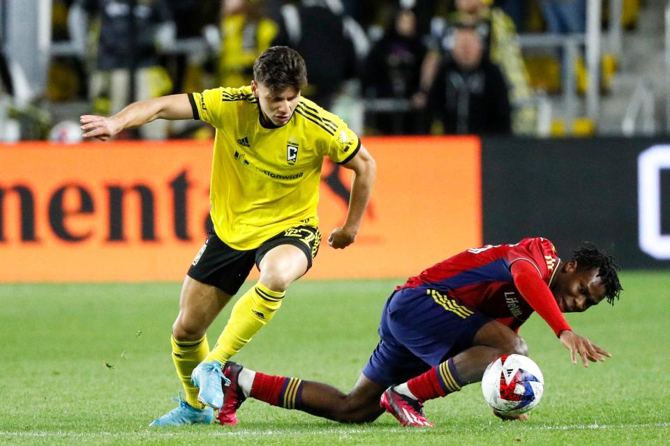 Apr 1, 2023; Columbus, Ohio, United States;  Columbus Crew forward Max Arfsten (27) contests the ball with Real Salt Lake defender Luis Rivera (25) during the second half of the MLS soccer game between Columbus Crew and Real Salt Lake at Lower.com Field on Saturday night. Mandatory Credit: Joseph Scheller-The Columbus Dispatch