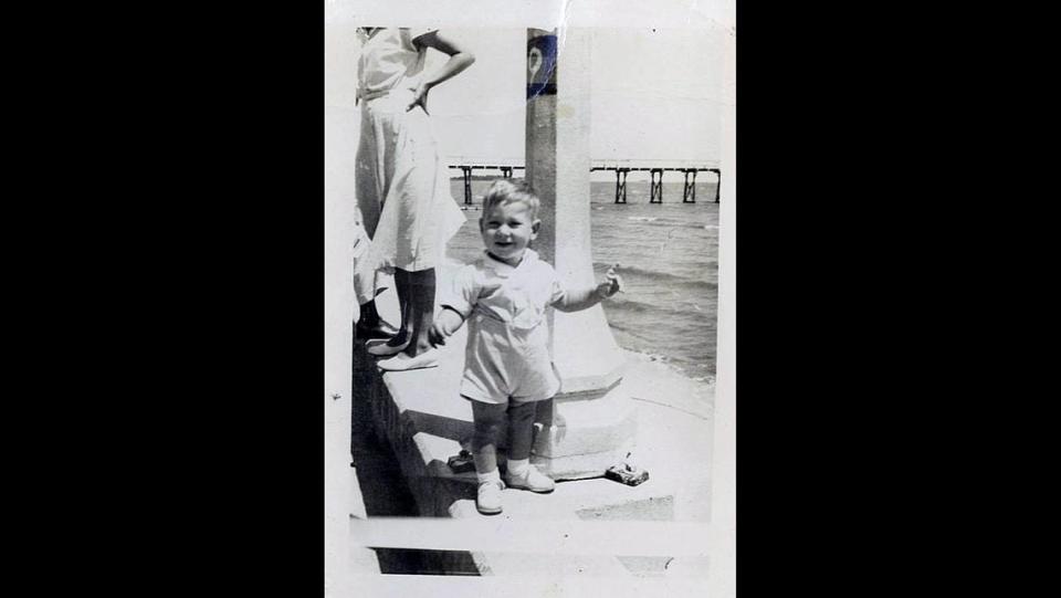 Jimmy Buffett is seen as a child visiting the beach in Mississippi.