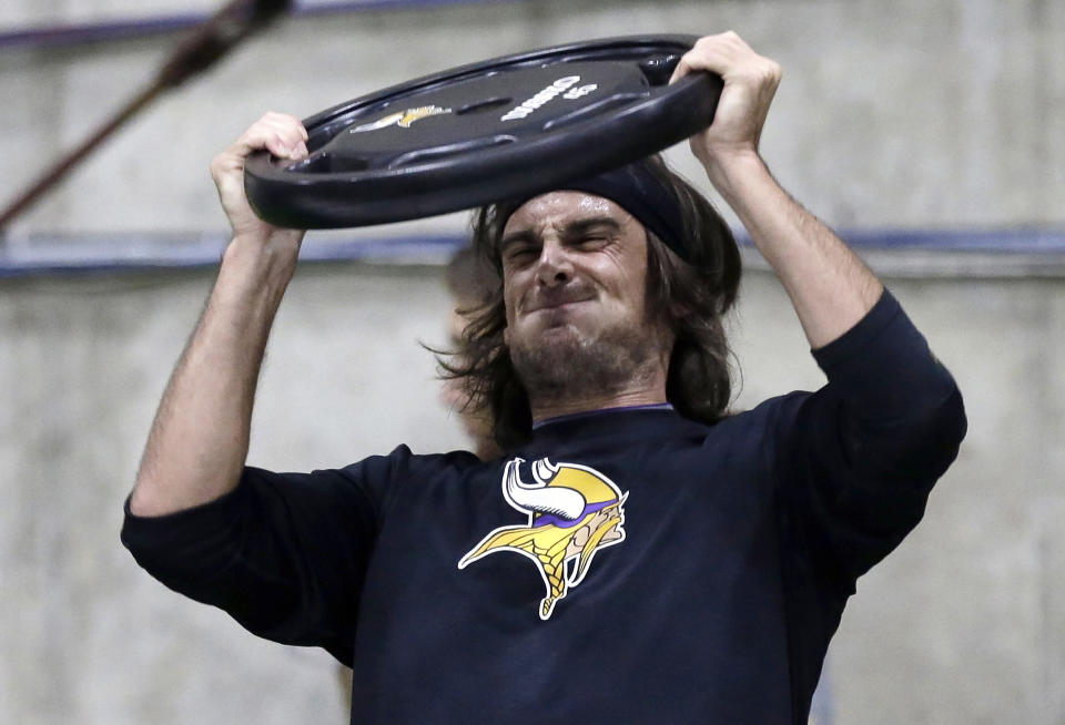 FILE - In this May 1, 2013, file photo, Minnesota Vikings punter Chris Kluwe lifts a weight during conditioning workouts for the NFL football team in Eden Prairie, Minn. Kluwe, who is no longer with the Vikings, says the team's special teams coordinator, Mike Priefer, made anti-gay comments while Kluwe was with the team. The Vikings issued a statement saying they take the allegations seriously. They also say he was released because of his football performance, not something else. (AP Photo/Jim Mone)
