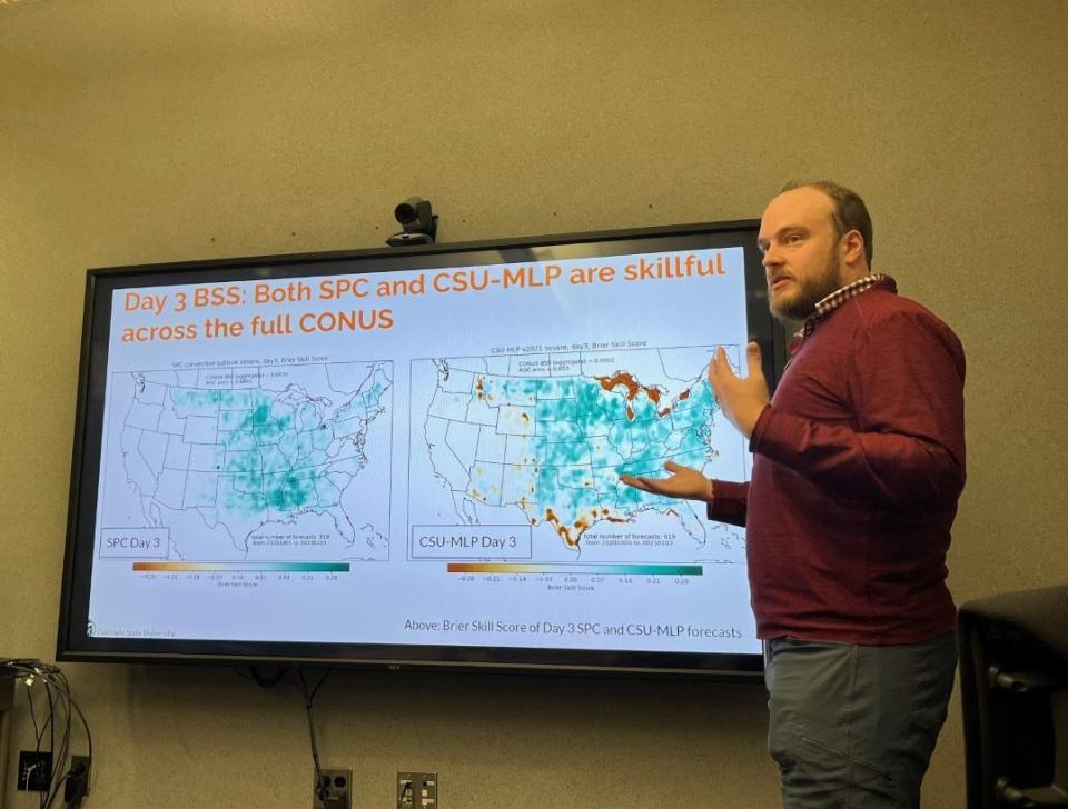 Aaron Hill, a research scientist in the Atmospheric Science Department at CSU, demonstrates a new severe weather model map at the National Weather Service Storm Prediction Center in Norman, Oklahoma.
