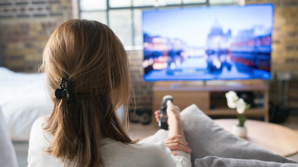 woman watching tv at home