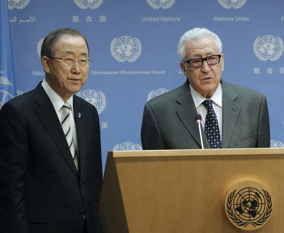 In this photo provided by the United Nations, United Nations Secretary General Ban Ki-moon, left, joins Lakhdar Brahimi as Brahimi announces his resignation as Joint Special Representative of the United Nations and the League of Arab States for Syria, Tuesday, May 13, 2014 at United Nations headquarters. After nearly two years in the position, Brahimi’s resignation becomes effective on May 31. (AP Photo/The United Nations, JC McIlwaine)