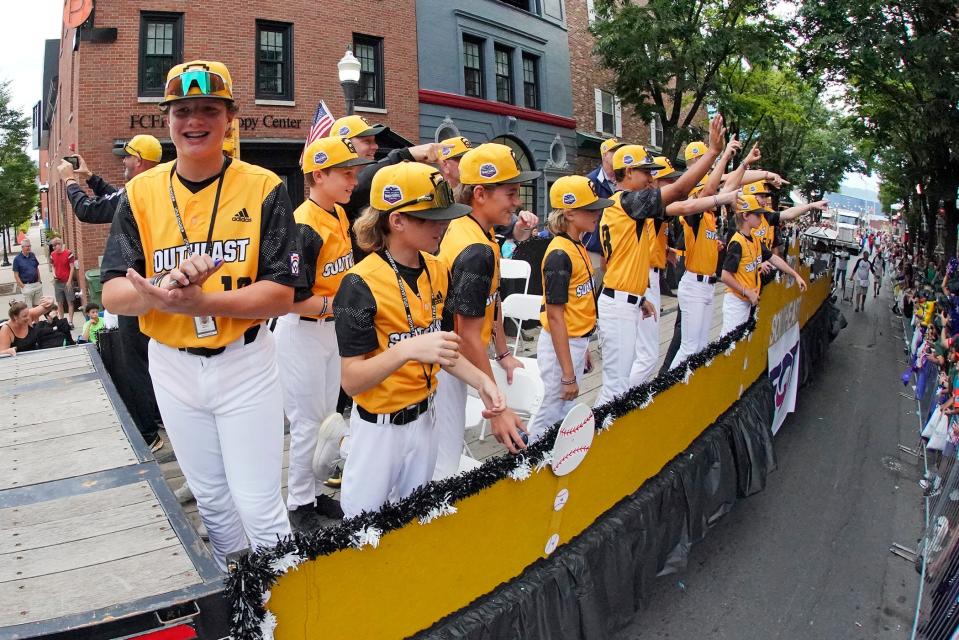 Southeast Region Champion Little League team from Nolensville, Tenn., rides in the Little League Grand Slam Parade in downtown Williamsport, Pa., on Monday, Aug. 15, 2022. The Little League World Series baseball tournament, featuring 20 teams from around the world, starts on August 17, 2022 in South Williamsport, Pa. (AP Photo/Gene J. Puskar)