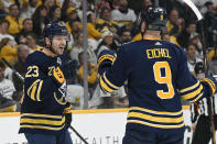 Buffalo Sabres center Sam Reinhart (23) celebrates with Jack Eichel (9) after Reinhart scored against the Nashville Predators during the first period of an NHL hockey game Saturday, Jan. 18, 2020, in Nashville, Tenn. (AP Photo/Mark Zaleski)