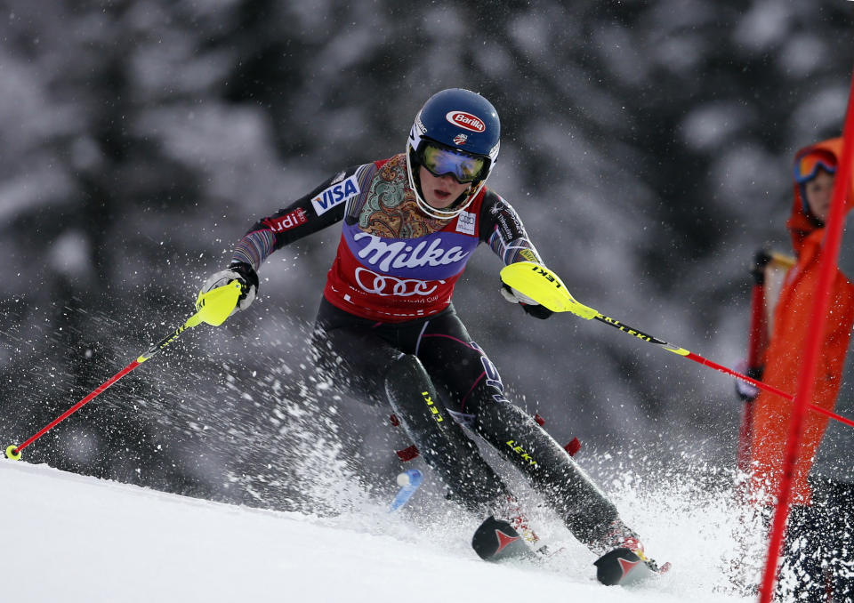 Mikaela Shiffrin, of the United States, speeds past a pole on her way to clock the fastest time during the first run of an alpine ski, women's World Cup slalom, in Bormio, Italy, Sunday, Jan. 5, 2013. (AP Photo/Marco Trovati)