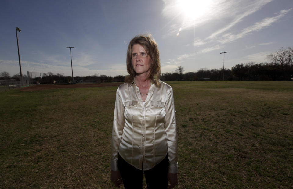 In this photo taken Wednesday, Feb. 29, 2012, Carol Bart poses for photos at a park in Richardson, Texas. In 1984, Bart was kidnapped and raped repeatedly in her car at knifepoint and she submitted to a rape kit at the time. It would be 24 years before the kit was tested, entered into the FBI’s Combined DNA Index System and produced a hit on Joseph Houston Jr. (AP Photo/LM Otero)