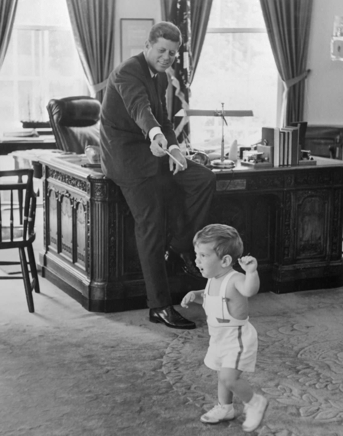 john f kennedy with 18 month old son john jr