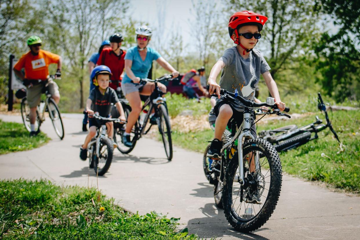 Families take off on a two-mile bike ride May 2022 as part of Local Motion's Mother's Day event Sunday in Stephens Lake Park.
