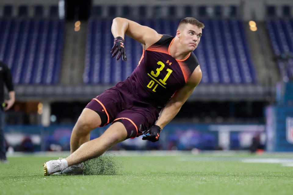 Charleston defensive lineman John Cominsky runs a drill at the NFL football scouting combine in Indianapolis, Sunday, March 3, 2019. (AP Photo/Michael Conroy)