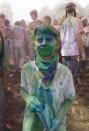 A reveler is covered in colored corn starch during the 2014 Festival of Colors, Holi Celebration at the Krishna Temple Saturday, March 29, 2014, in Spanish Fork, Utah. Nearly 70,000 people are expected to gather starting Saturday at a Sri Sri Radha Krishna Temple in Spanish Fork for the annual two-day festival of colors. Revelers gyrate to music and partake in yoga during the all-day festival, throwing colored corn starch in the air once every hour. The Salt Lake Tribune reports that the large majority of participants are not Hindus, but Mormons. Thousands of students from nearby Brigham Young University come to take part in a festival that is drug and alcohol free. The event stems from a Hindu tradition celebrating the end of winter and the triumph of good over evil. (AP Photo/Rick Bowmer)