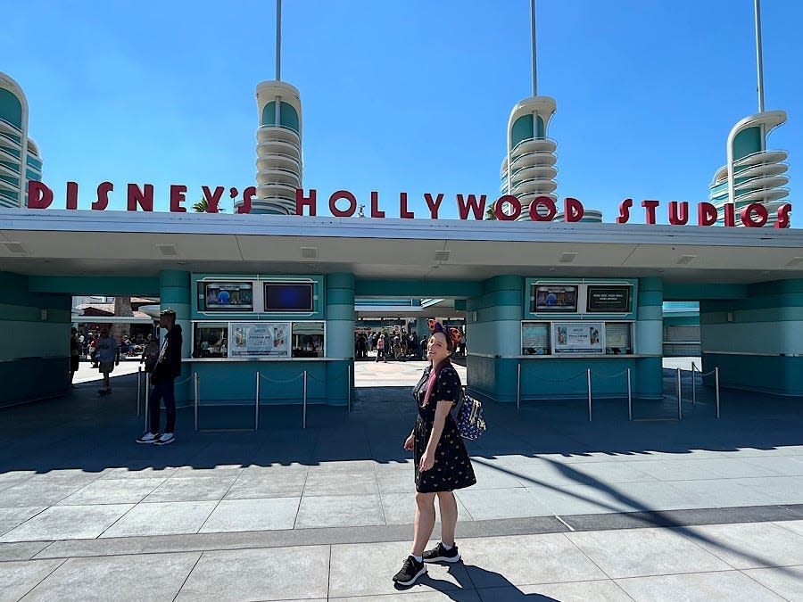 jenna posing in front of the hollywood studios entrance sign