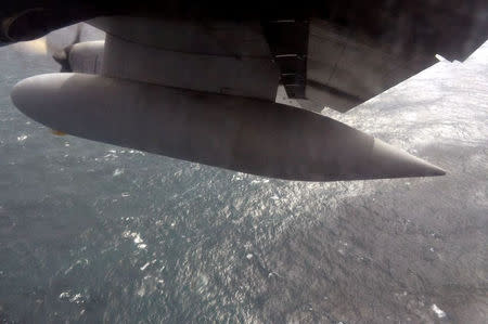 An Argentine Navy airplane is seen as it flies over the Atlantic Ocean during the search for the ARA San Juan submarine missing at sea, Argentina November 22, 2017. Argentine Navy/Handout via REUTERS ATTENTION EDITORS - THIS IMAGE WAS PROVIDED BY A THIRD PARTY.