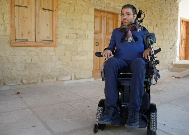 Marc Torbey el Helou, head of Lebanese NGO Offre Joie, talks during an interview with Reuters in Beirut