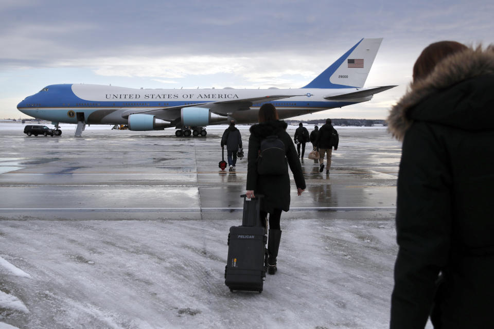 Members of the media walk across the tarmac to board Air Force One ahead of President Donald Trump's arrival at Andrews Air Force Base, Md., Monday Jan. 14, 2019, en route to New Orleans. (AP Photo/Jacquelyn Martin)