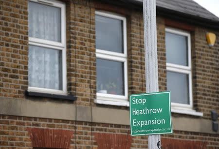 An anti-Heathrow airport expansion protest sign is seen in the threatened village of Sipson, adjacent to the airport in London, Britain July 1, 2015. REUTERS/Peter Nicholls