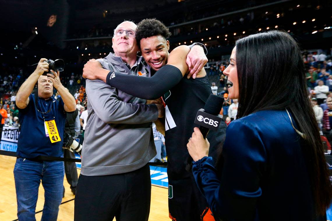 Mar 26, 2023; Kansas City, MO, USA; Miami Hurricanes head coach Jim Larranaga left, hugs guard Jordan Miller (11) as they celebrate defeating the Texas Longhorns at the T-Mobile Center.