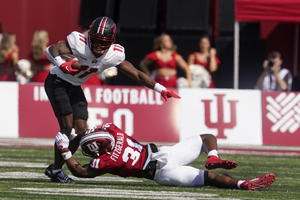 Western Kentucky wide receiver Malachi Corley (11) is tackled by Indiana defensive back Bryant Fitzgerald (31) during the first half of an NCAA college football game, Saturday, Sept. 17, 2022, in Bloomington, Ind. (AP Photo/Darron Cummings)