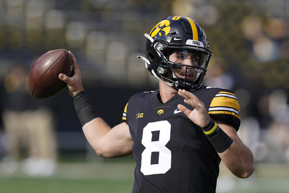 FILE - Iowa quarterback Alex Padilla (8) warms up before an NCAA college football game against Illinois, Saturday, Nov. 20, 2021, in Iowa City, Iowa.The battle this spring is between veteran starter Spencer Petras and Alex Padilla. (AP Photo/Charlie Neibergall, File)