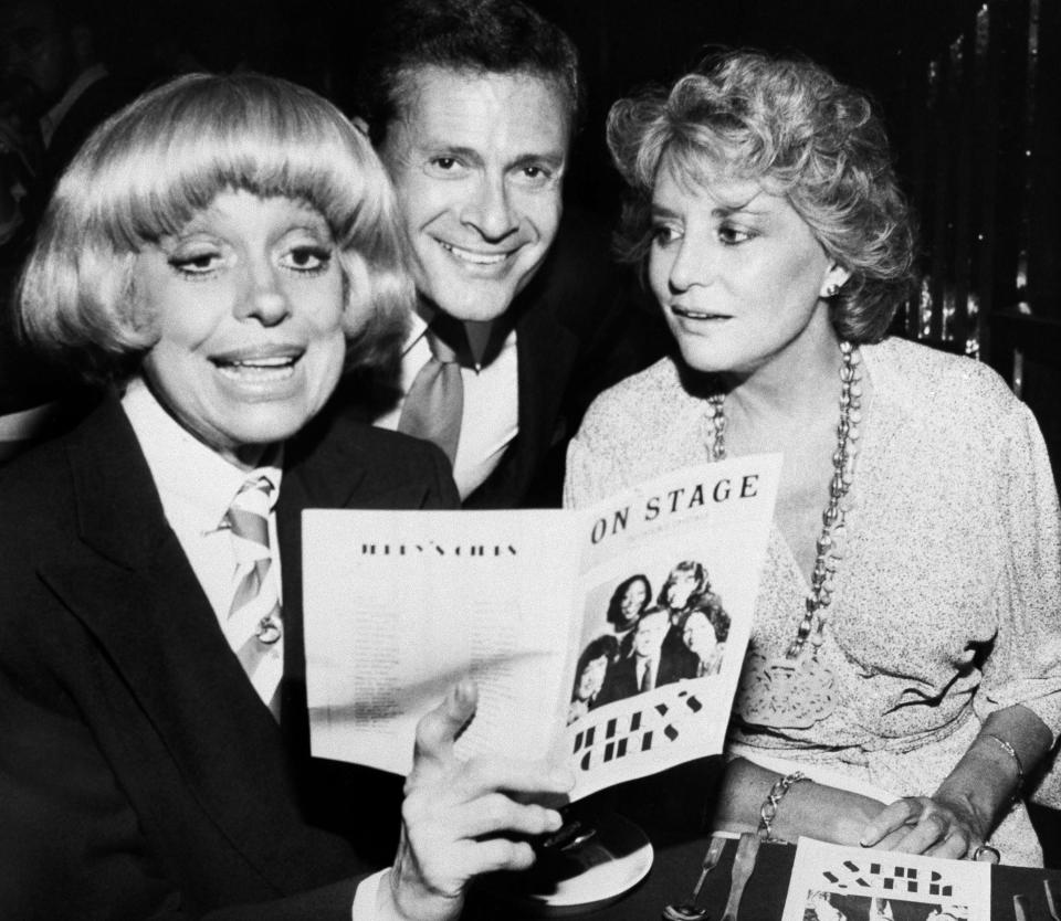 FILE - In this Sept. 1, 1981, file photo, Carole Channing, left, and television personality Barbara Walters look over the program with composer-lyricist Jerry Herman at a Broadway Theater. Herman, the Tony Award-winning composer behind "Hello, Dolly!" and "La Cage aux Folles," has died at age 88. (AP Photo/ David Gould)