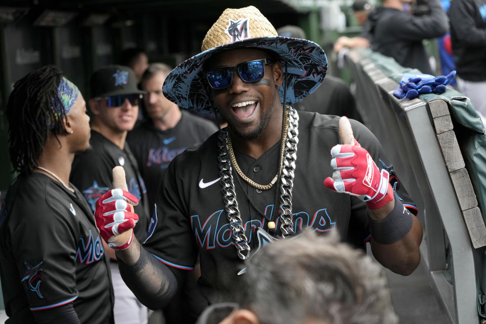 FILE - Miami Marlins' Jorge Soler celebrates his home run in the dugout off Chicago Cubs starting pitcher Drew Smyly on Saturday, May 6, 2023, in Chicago. About half the clubs in MLB are using some kind of prop or ritual to celebrate a big hit or a big play in ways that often go viral. (AP Photo/Charles Rex Arbogast, File)