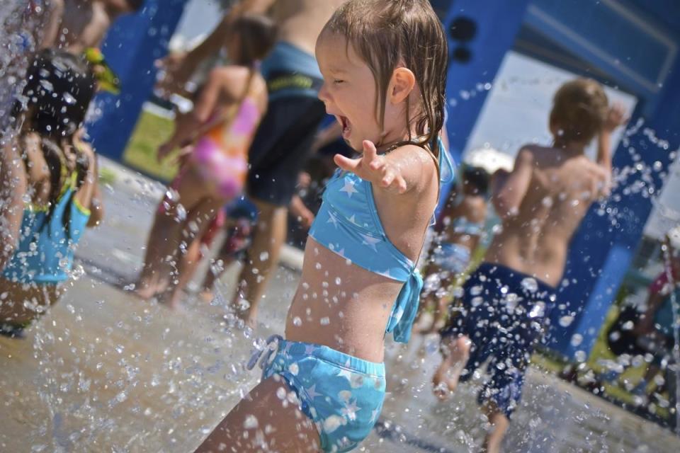 Children playing at a spray park in Burnaby