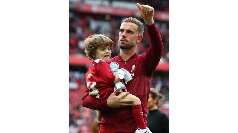 Jordan Henderson with his son