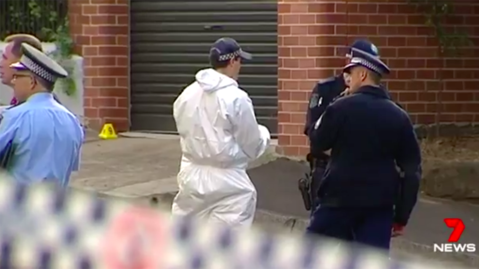 Police are hunting for a man and a woman after a man was found with fatal head injuries just metres away from a Sydney school. Source: 7 News