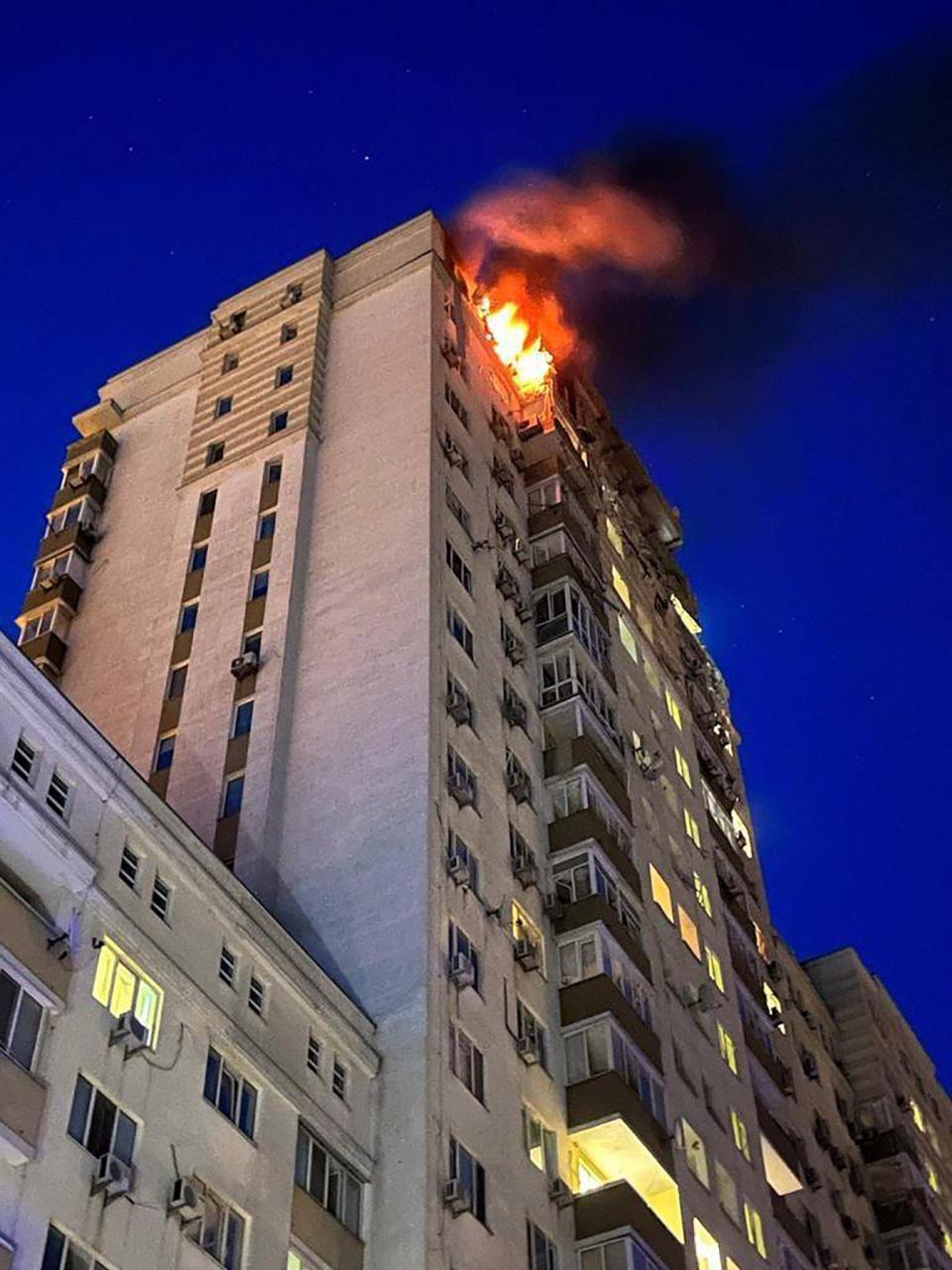 A fire at an apartment building after being damaged during a drone strike in Kyiv (EPA)