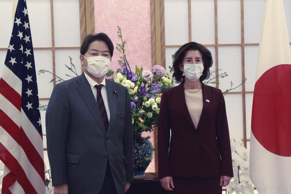 U.S. Commerce Secretary Gina Raimondo, right, poses for a photo with Japanese Foreign Minister Yoshimasa Hayashi prior to their meeting in Tokyo, Monday, Nov. 15, 2021. U.S. and Japanese officials agreed Monday to launch talks aimed at settling a dispute over American tariffs on imports of Japanese steel and aluminum. (AP Photo/Koji Sasahara, Pool)