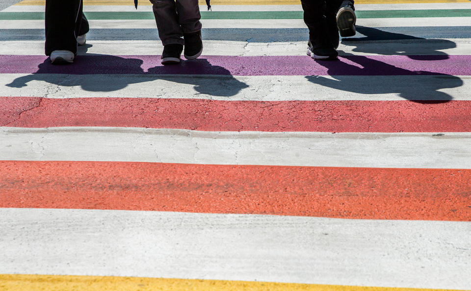 <p>People walk on one of the six pedestrian crossings in the colors of the rainbow flag in Brussels, Belgium, May 10, 2017. At ten days of the Belgian Pride, the city of Brussels put in the colors of the rainbow flag on 06 pedestrian crossings in the LGTBQI district of the city. The 06 pedestrian crossings will remain colorful for the next 8 months. (Photo: Stephanie Lecocq/EPA) </p>