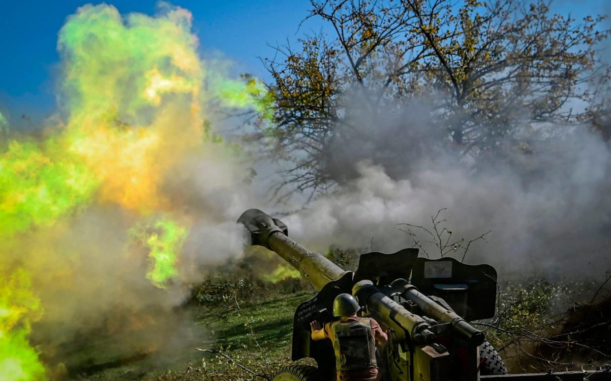 An Armenian soldier fires artillery on the front line on October 25, 2020, during the ongoing fighting between Armenian and Azerbaijan - Aris Messinis/AFP