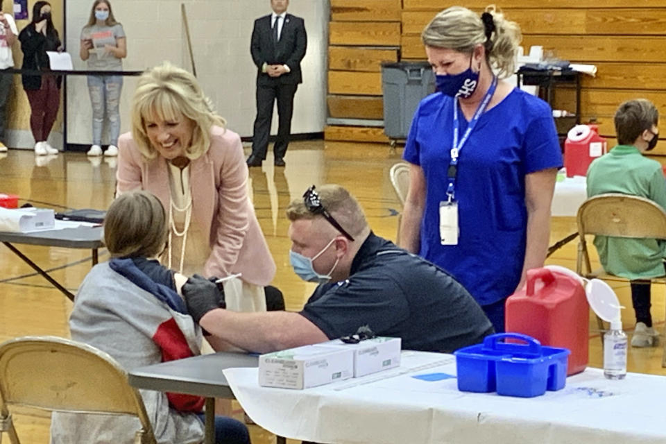 First lady Jill Biden talks to a student who received her coronavirus vaccination Thursday, May 13, 2021, at Capital High School in Charleston, W.Va. (Kenny Kemp/Charleston Gazette-Mail via AP)