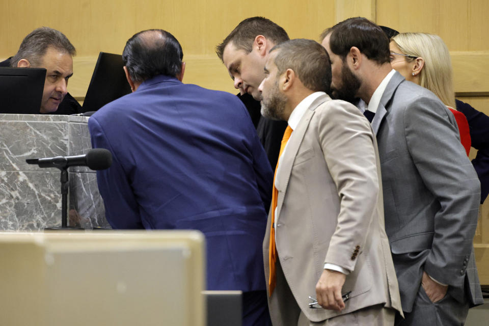 Attorneys meet with Judge Michael Usan for a sidebar discussion during closing arguments in the XXXTentacion murder trial at the Broward County Courthouse in Fort Lauderdale, Fla., Tuesday, March 7, 2023. Emerging rapper XXXTentacion, born Jahseh Onfroy, 20, was killed during a robbery outside of Riva Motorsports in Pompano Beach in 2018, allegedly by defendants Michael Boatwright, Trayvon Newsome, and Dedrick Williams. (Amy Beth Bennett/South Florida Sun-Sentinel via AP, Pool)