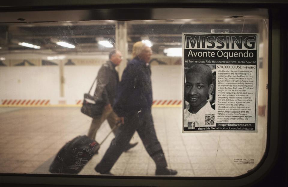 A missing poster for Avonte Oquendo, a 14-year-old autistic boy who has been missing for 3 weeks since walking out of his school, is posted on a subway window in the Times Square station of New York, October 25, 2013. New York Police commissioner Ray Kelly has been quoted in local media saying "Unfortunately, we are not hopeful that we're going to find this young man alive, but we are continuing our search." (REUTERS/Carlo Allegri)