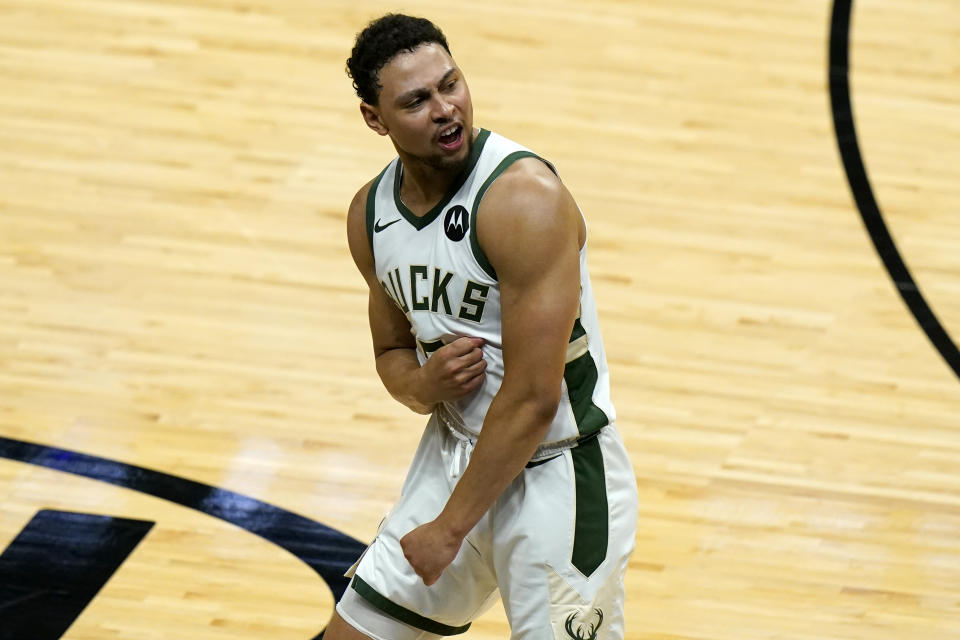 Milwaukee Bucks guard Bryn Forbes reacts after scoring on a 3-pointer during the second half of Game 4 of an NBA basketball first-round playoff series against the Miami Heat, Saturday, May 29, 2021, in Miami. (AP Photo/Lynne Sladky)