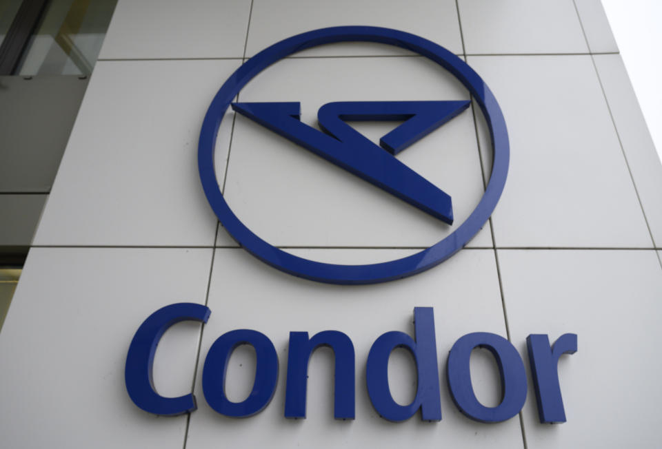 The Condor airline logo on an airline building in Frankfurt airport, Friday Jan. 24, 2020. The owner of Polish carrier LOT is taking over German airline Condor, a subsidiary of collapsed tour operator Thomas Cook, according to an announcement Friday. (Boris Roessler/dpa via AP)